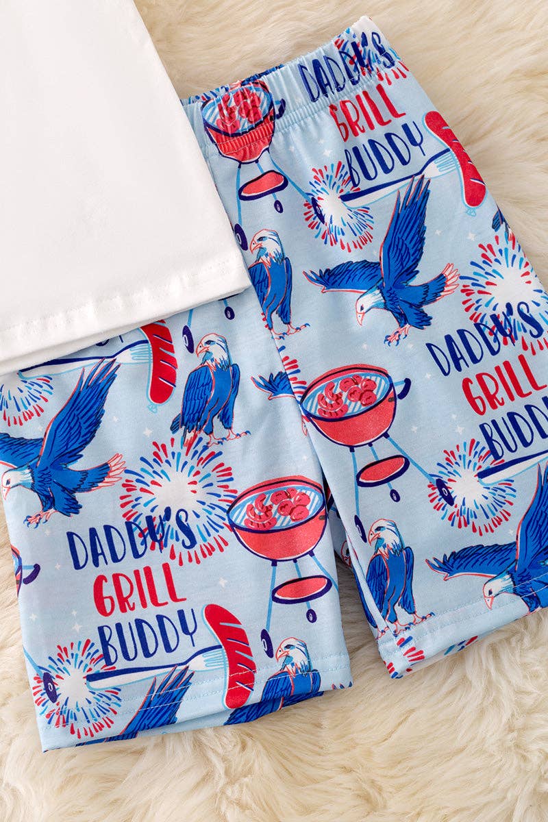 "Daddy's Grill Buddy" White T-shirt & blue multi printed shorts.