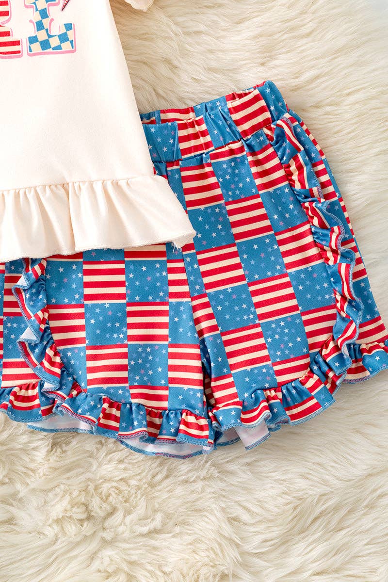 "American Girl" Ivory ruffle top and flag printed shorts with ruffle detail.