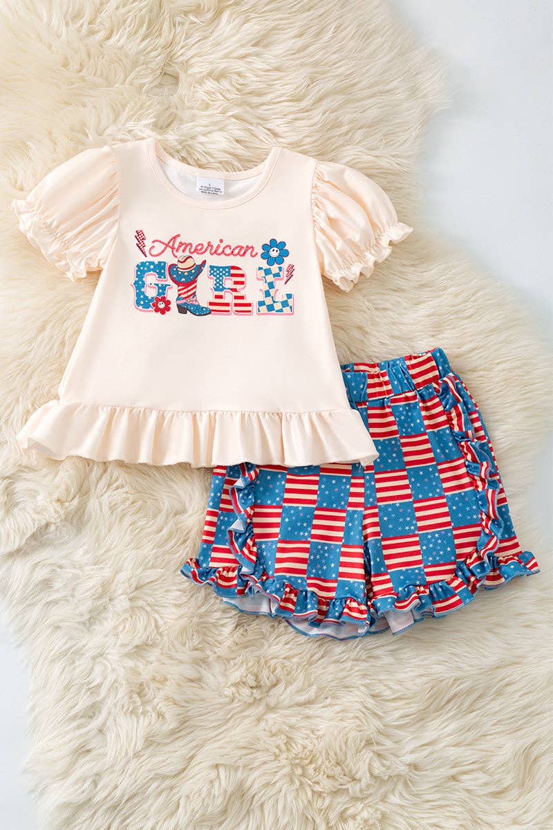 "American Girl" Ivory ruffle top and flag printed shorts with ruffle detail.